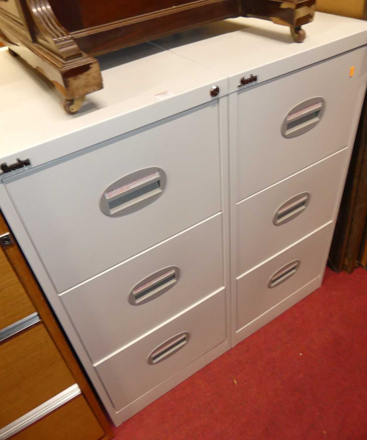 A pair of Silverline metal three drawer office filing cabinets, w.46cm; together with a teak