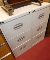 A pair of Silverline metal three drawer office filing cabinets, w.46cm; together with a teak