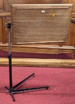 A mid-20th century painted iron and hardwood adjustable reading stand, with rise and fall and