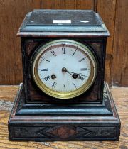 A Victorian black slate and rouge marble mantel clock