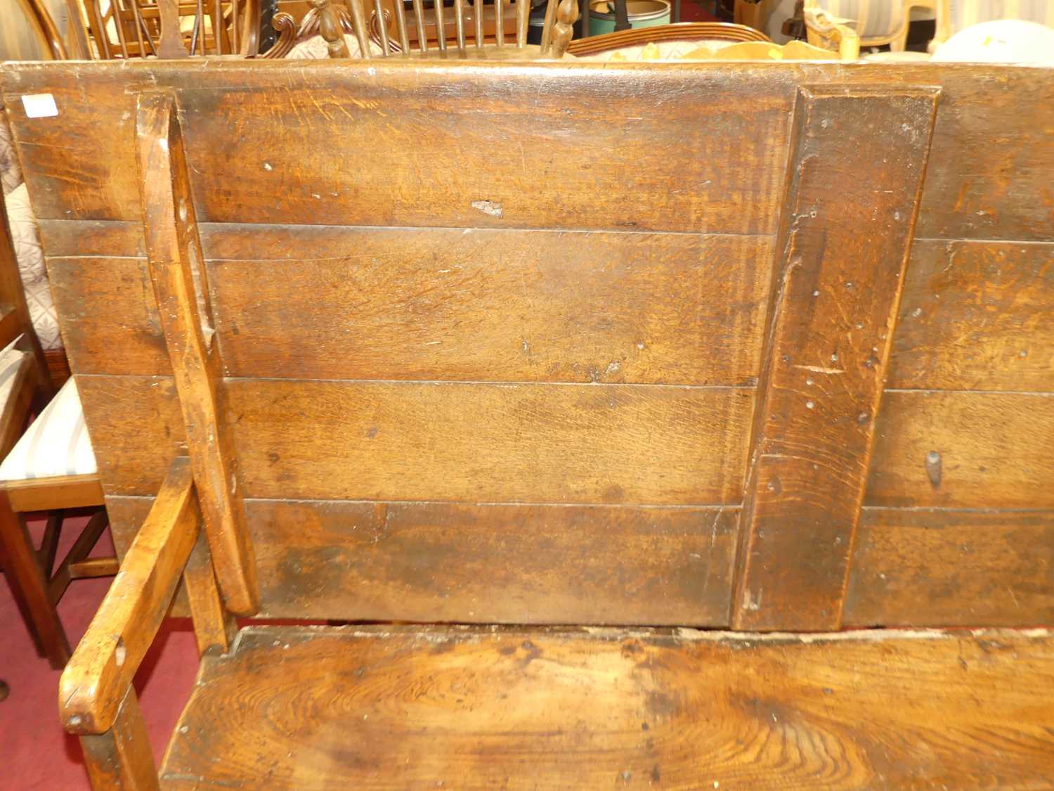 An antique joined oak and elm long bench settle, having a fold-over top, length 181cm Some losses - Image 2 of 8