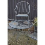 A wired metal patio suite comprising circular table and four tub elbow chairs (5) Appears to be