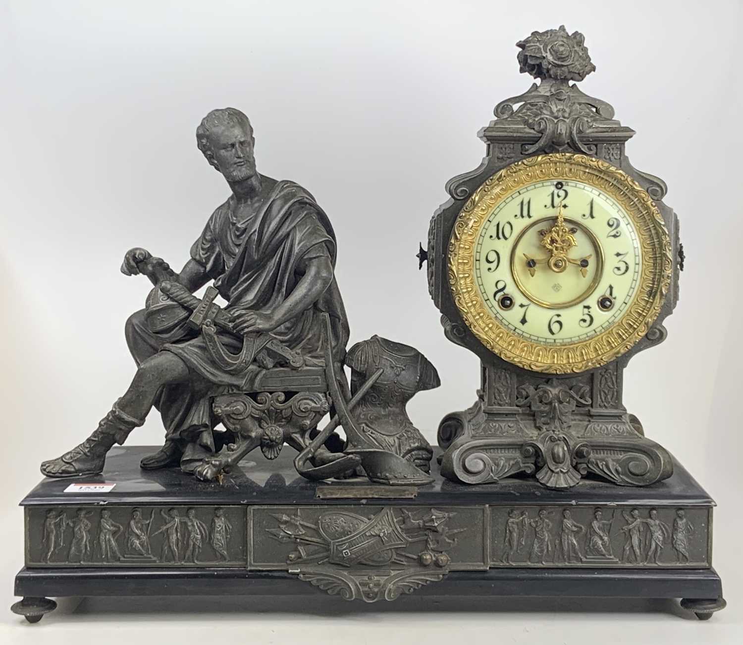 A late C19th American Ansonia spelter mantel clock, the clock flanked with a centurion at rest,