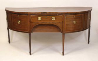 A George III mahogany and inlaid demi-lune sideboard, of large proportions, having a centre frieze
