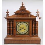 A circa 1900 oak mantel clock of architectural outline having spring driven movement, height 50cm