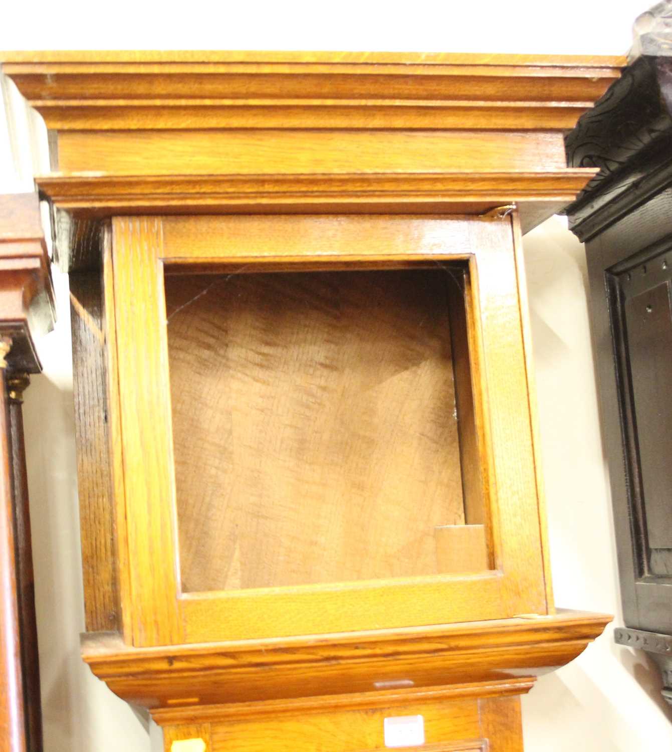 A blond oak long case clock case, only, in the late 17th century style, height 204cm Hood door glass