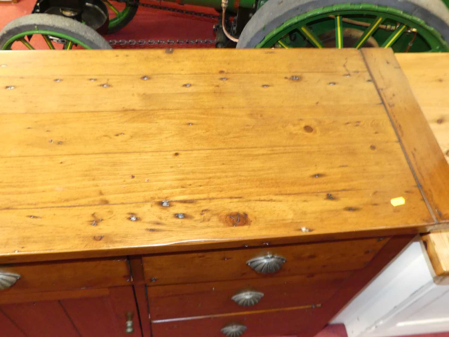 A contemporary stained pine sideboard, fitted with seven drawers and central cupboard door, w.172cm - Image 3 of 4