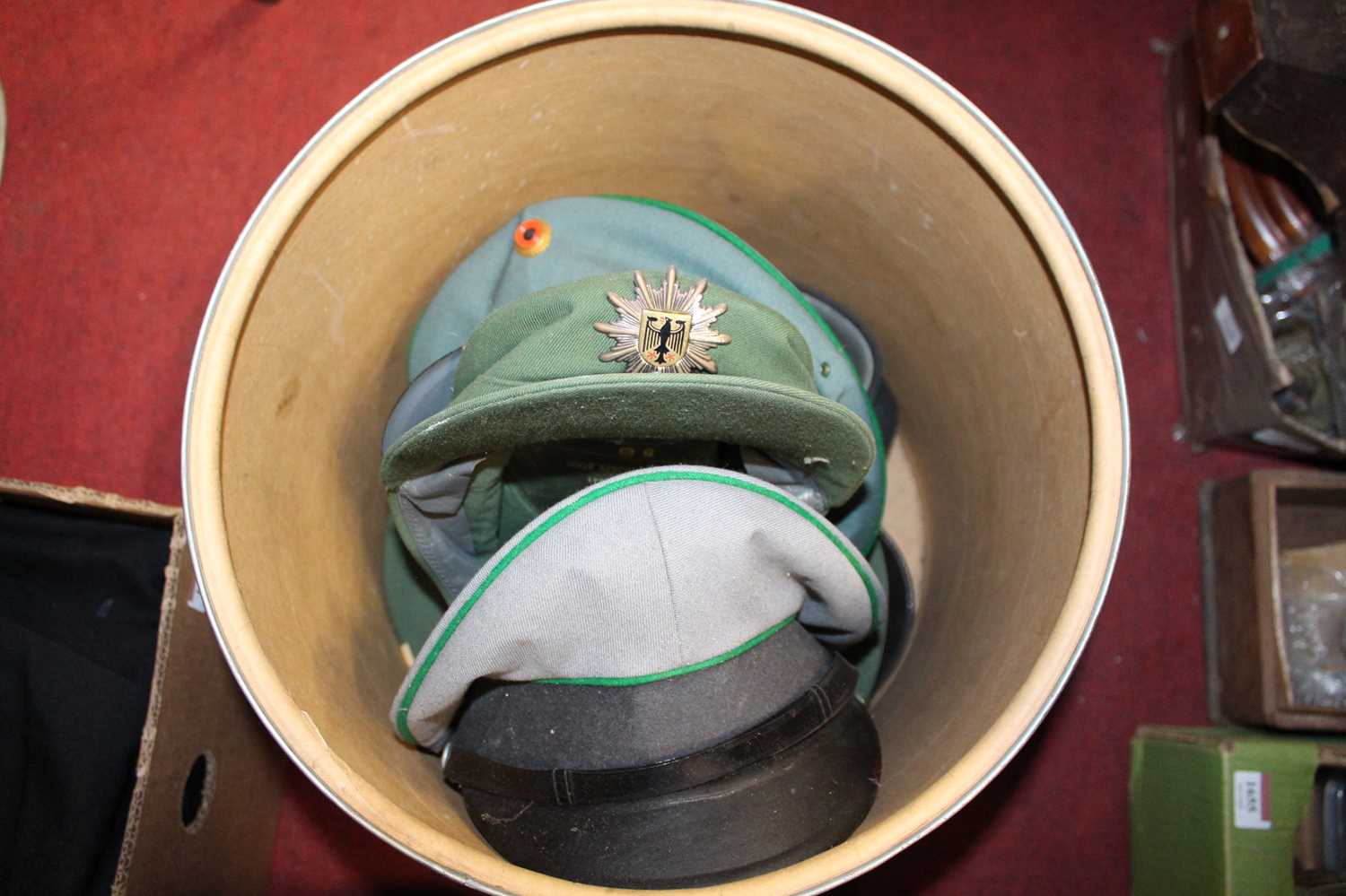 Two boxes of assorted headwear, to include German Military Police visor caps etc - Image 2 of 2