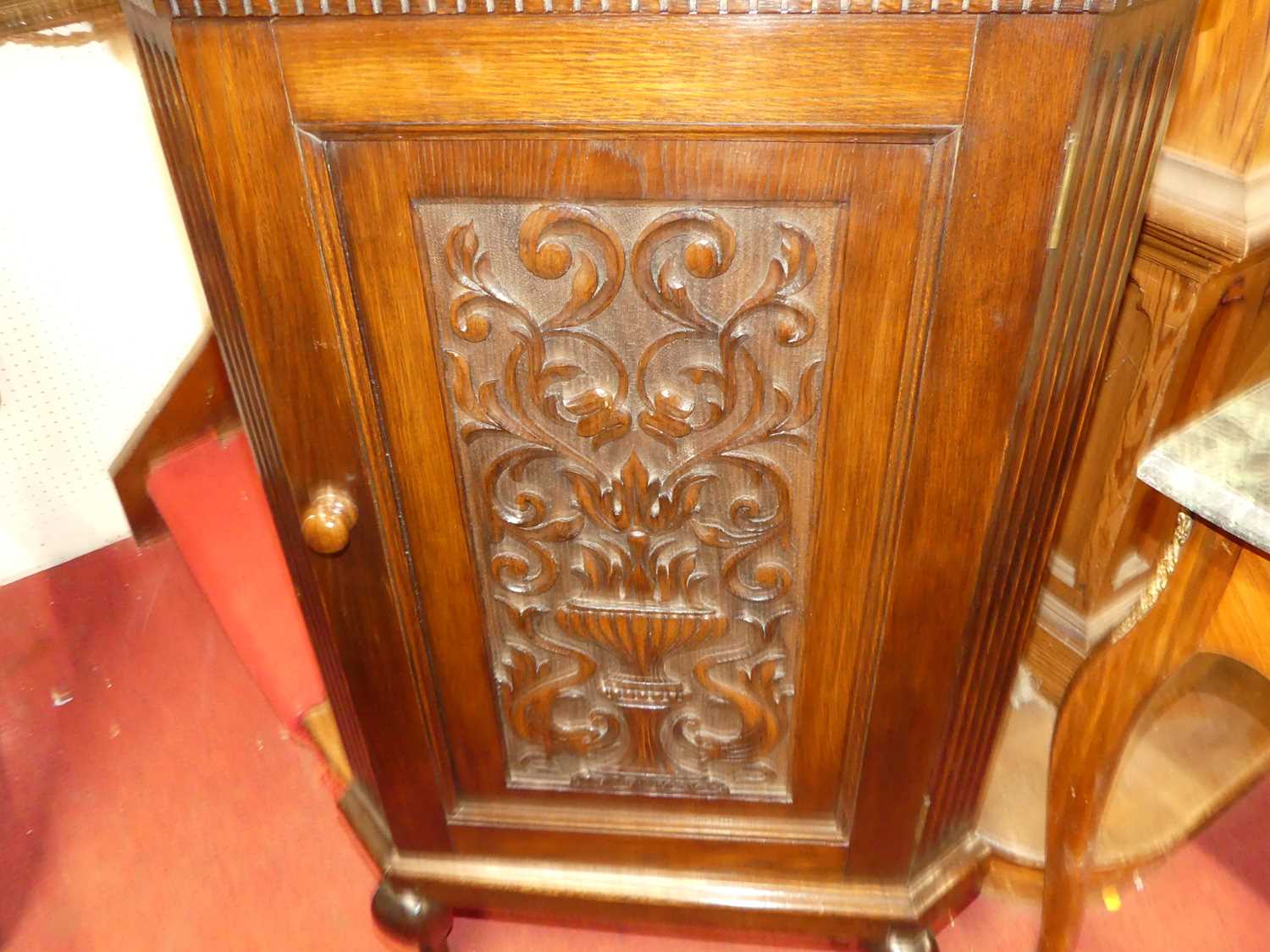 An early 20th century floral relief carved oak single door freestanding corner cupboard, on squat - Image 3 of 3