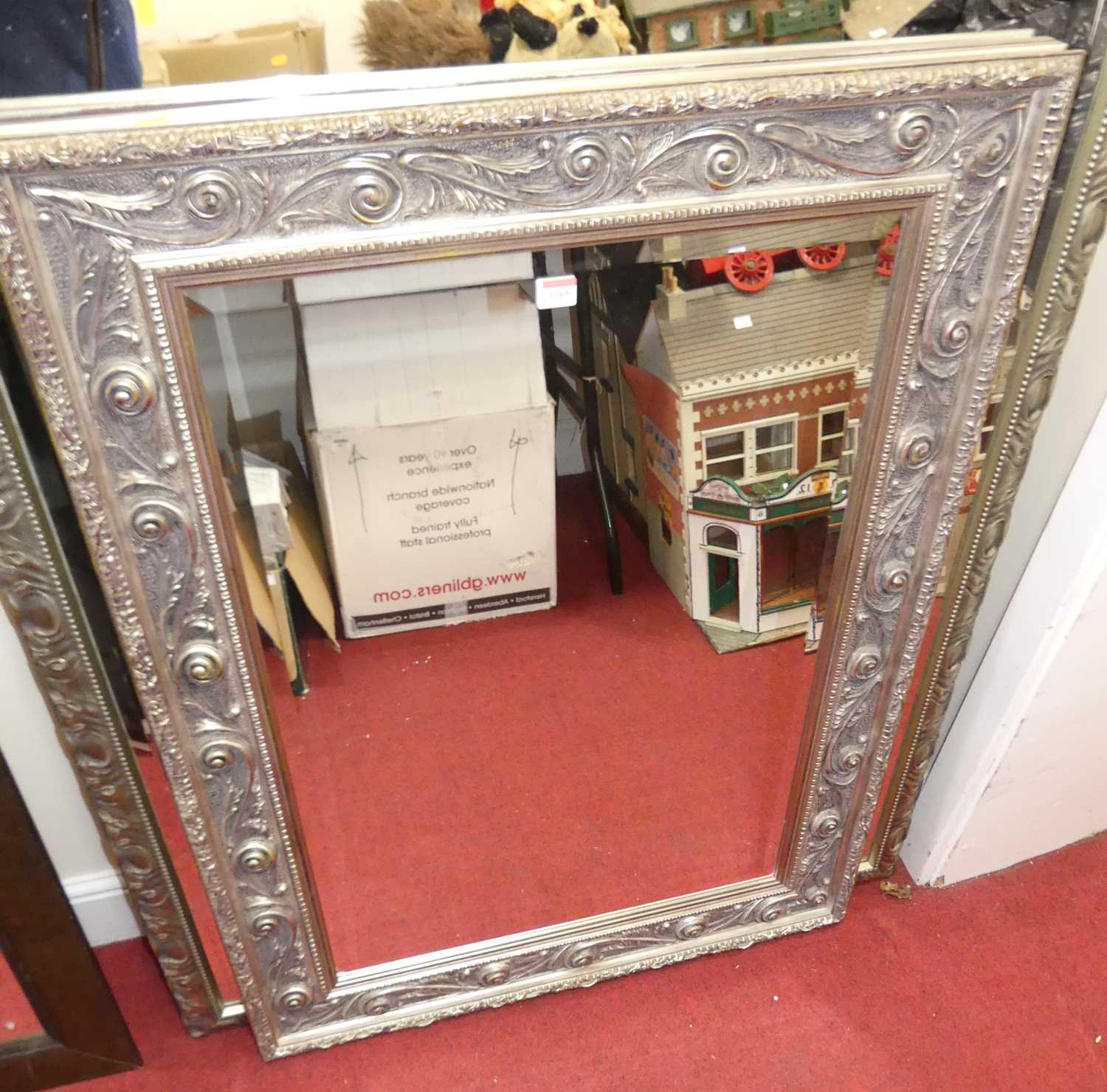 A contemporary floral silvered framed bevelled rectangular wall mirror, 111.5 x 81.5cm