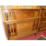 An Edwardian mahogany and floral satinwood inlaid and further chequer strung double bedstead, the