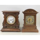 An Edwardian inalid mahogany dome topped mantel clock, having a signed white enamel dial (dial a/f),