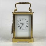 A circa 1900 French lacquered brass carriage clock, having visible platform escapement, unsigned