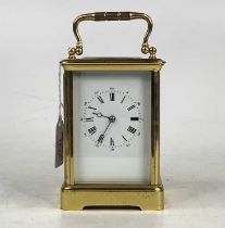 A circa 1900 French lacquered brass carriage clock, having visible platform escapement, unsigned