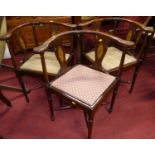 A set of four contemporary mahogany tub corner chairs, each with panelled seats