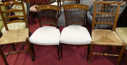 A pair of circa 1900 mahogany and floral satinwood inlaid bar and slatback dining chairs; together