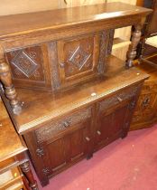A joined oak court cupboard, with label for Merryweather & Son of Holloway, London, to inside
