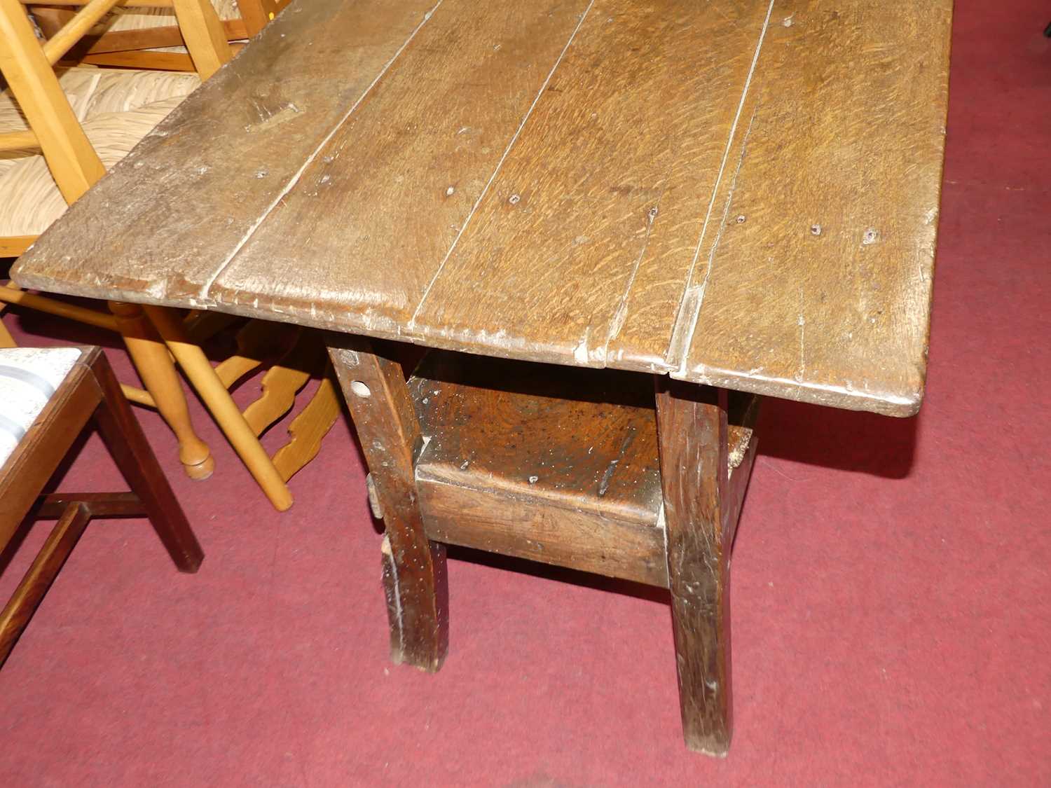 An antique joined oak and elm long bench settle, having a fold-over top, length 181cm Some losses - Image 5 of 8