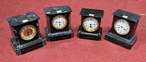 A late Victorian polished black slate and rouge marble inset black mantel clock having white