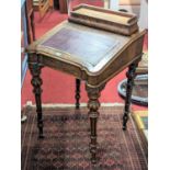 A mid-Victorian figured walnut slope front Davenport, having hinged stationery compartment, gilt