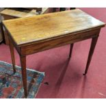 An early 19th century mahogany fold-over tea table, with rear gateleg action on square tapering