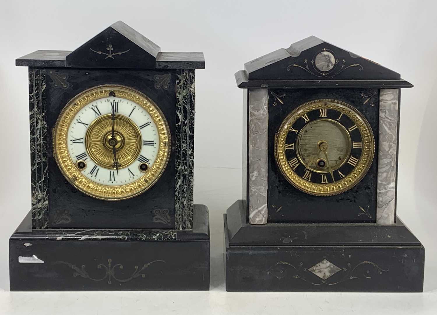 A late 19th-century slate mantel clock of architectural outline having a black enamelled Roman