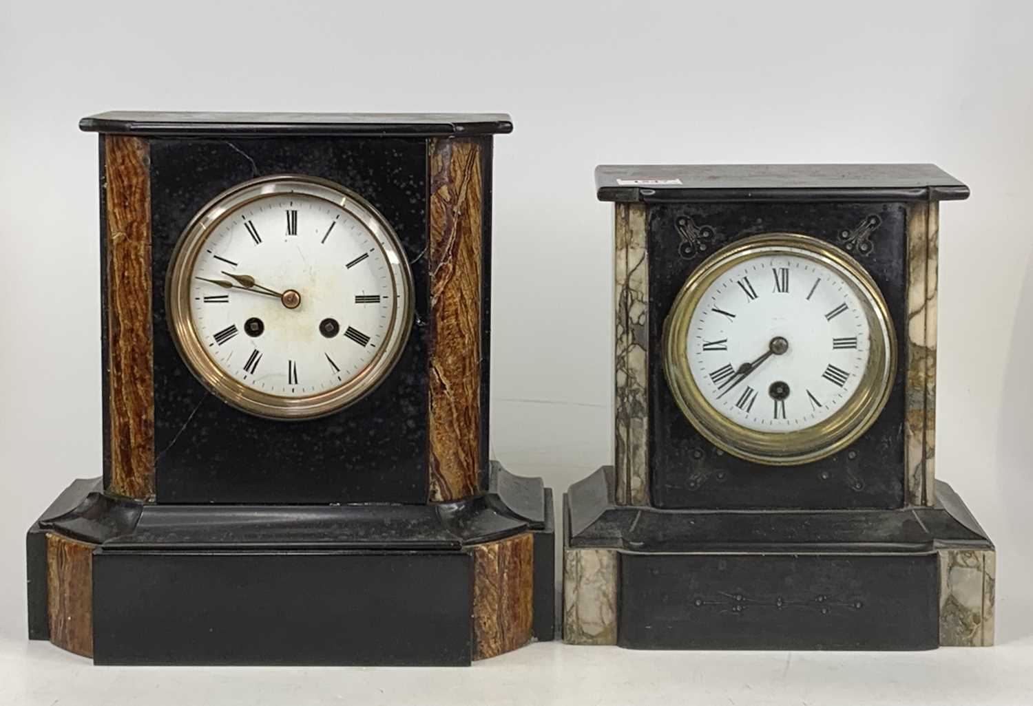 A late Victorian slate mantel clock, having rouge marble inlaid pilasters flanking white enamel