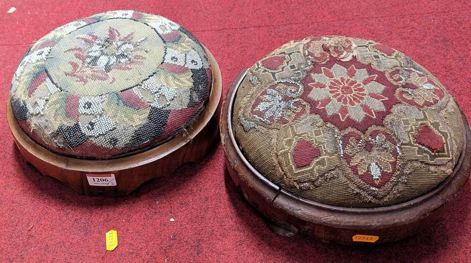 Two similar Victorian walnut and Berlin beadwork topped circular low foot stools Each with losses