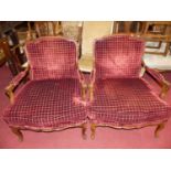 A pair of French beech framed and chequer rouge fabric plush upholstered open armchairs, each having