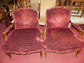 A pair of French beech framed and chequer rouge fabric plush upholstered open armchairs, each having