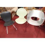 A perspex 'bucket' chair; together with a Galvano Tecnica single chair; and a set of three