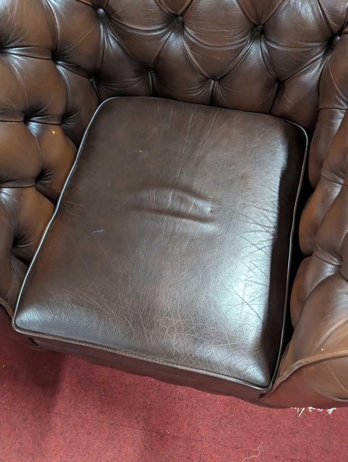 A pair of contemporary tan leather buttoned and further brass studded Chesterfield armchairs by - Image 4 of 5