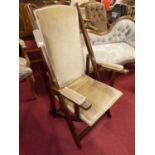 A circa 1900 mahogany folding campaign chair, with close-nailed upholstery, w.61cm