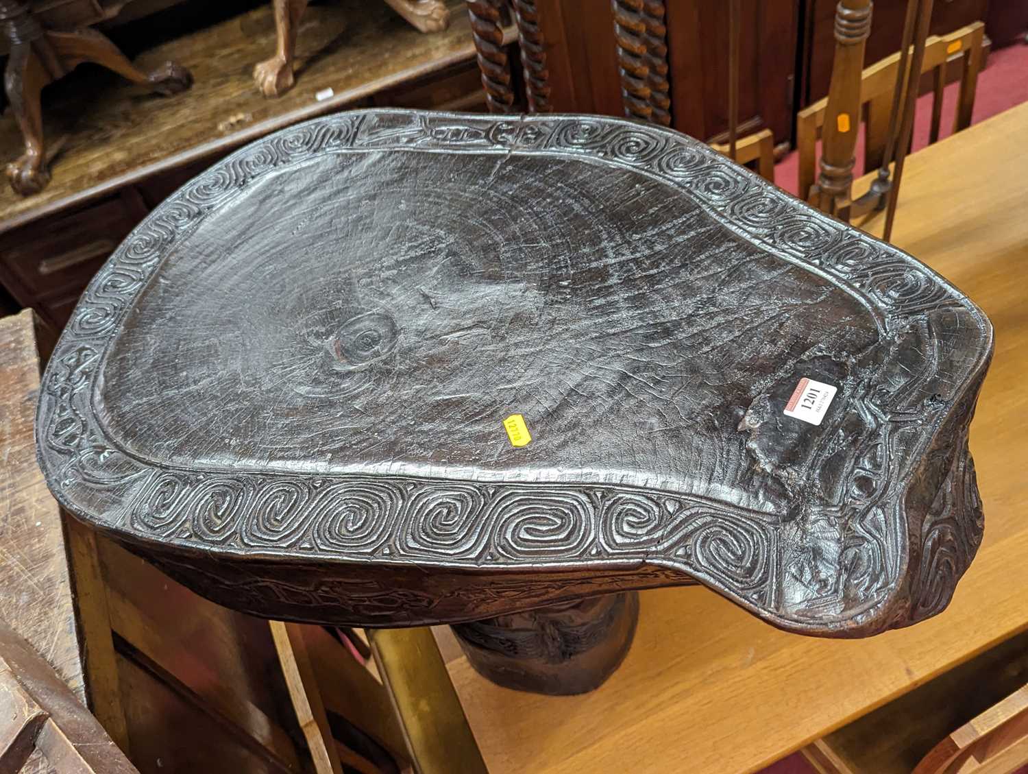 An Indonesian Saur tree slab table from the island of Timor, with stylised carved banded design, - Image 2 of 2