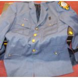 A collection of assorted police uniforms, to include Lakewood Police tunic, various shirts etc