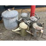 A galvanised metal swing handled bucket and cover, together with four further galvanised metal