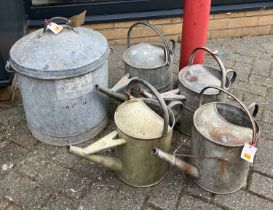 A galvanised metal swing handled bucket and cover, together with four further galvanised metal