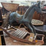 A child's hardwood and polychrome painted rocking horse, length of base 83cm