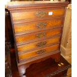 An Edwardian walnut music chest of five long drawers, the drawers with hinged flaps, w.44.5cm