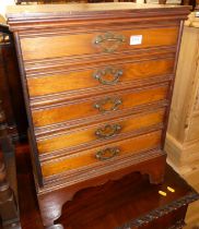 An Edwardian walnut music chest of five long drawers, the drawers with hinged flaps, w.44.5cm