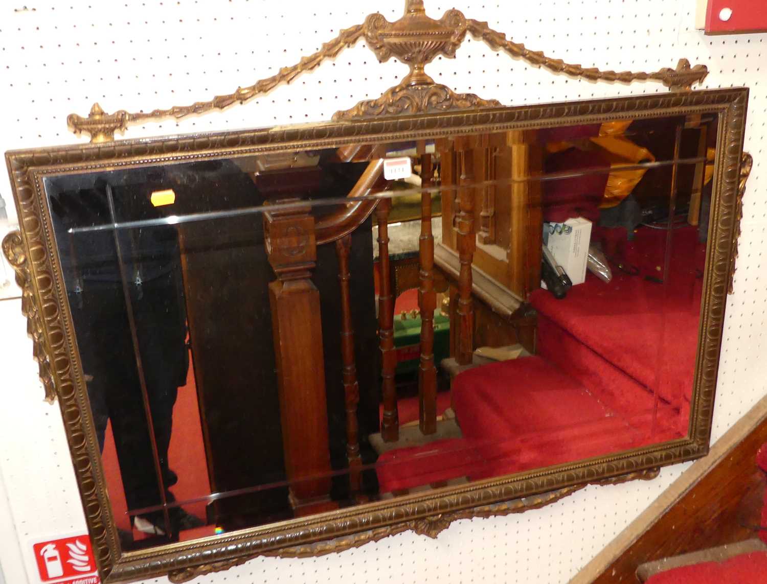 A reproduction gilt composition framed wall mirror in the Adam style, w.97cm; together with a gilt