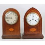 An Edwardian inlaid mahogany gothic mantel clock having unsigned white enamel dial, eight-day spring