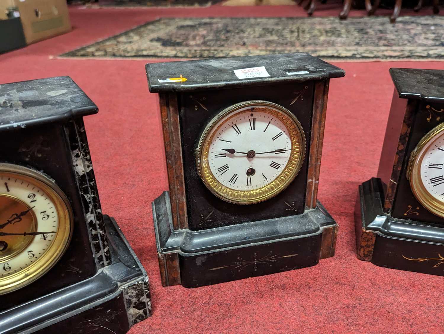 A late Victorian polished black slate and rouge marble inset black mantel clock having white - Image 2 of 4