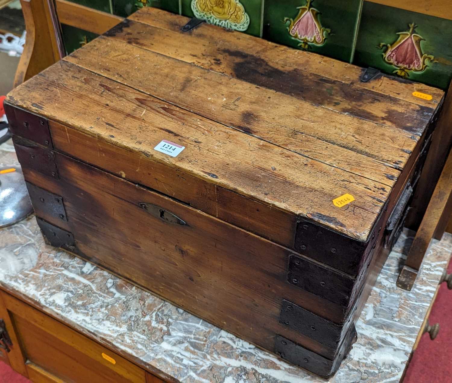 A 19th century stained and boarded pine and further iron mounted hinge topped tool chest, width 51.