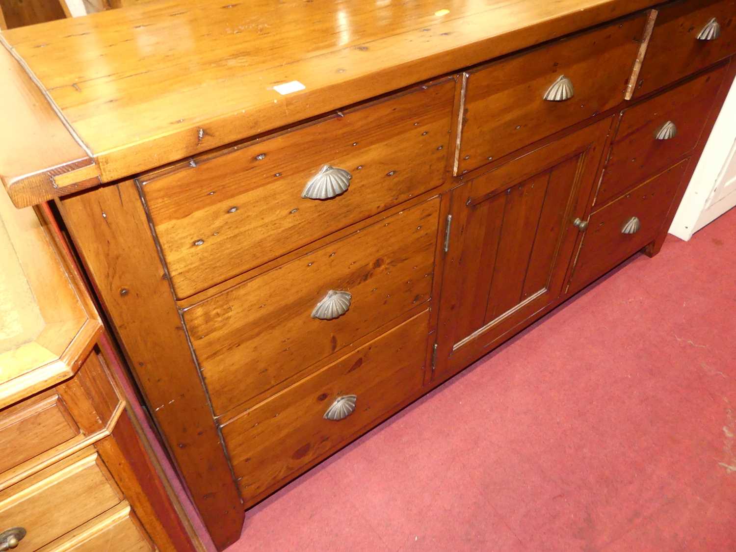 A contemporary stained pine sideboard, fitted with seven drawers and central cupboard door, w.172cm - Image 4 of 4