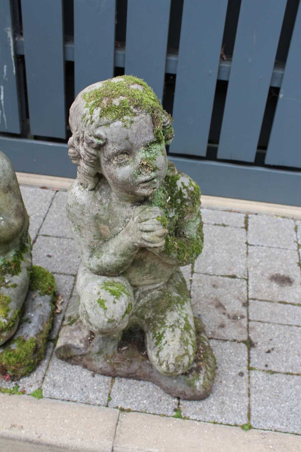 A pair of reconstituted stone garden figures, each modelled as a kneeling young girl, to - Image 2 of 3