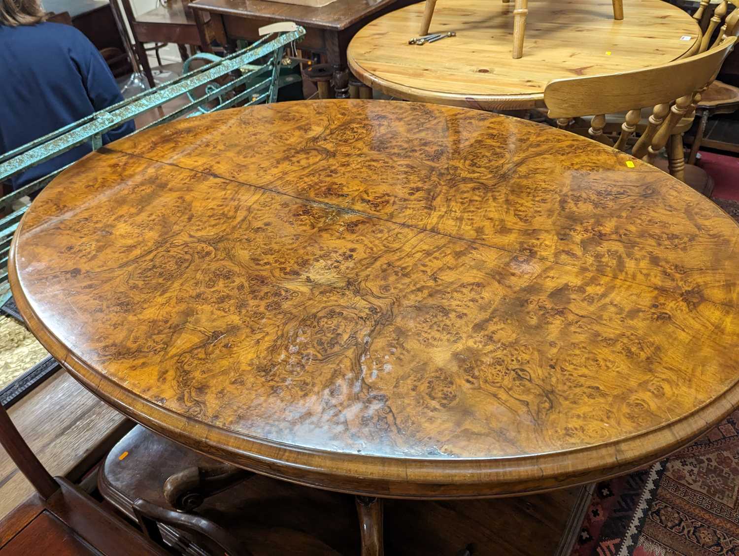 A mid-Victorian figured walnut oval tilt-top pedestal breakfast table, raised on acanthus carved and - Image 2 of 3