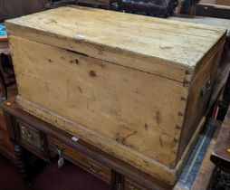 A Victorian pine hinge top tool chest with iron end carry handles, width 96.5cm