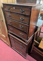 A pair of small mahogany square front chests, each of four long graduated drawers, width 61cm