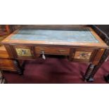 A late Victorian Aesthetic Movement walnut and gilt tooled leather inset kneehole writing table,